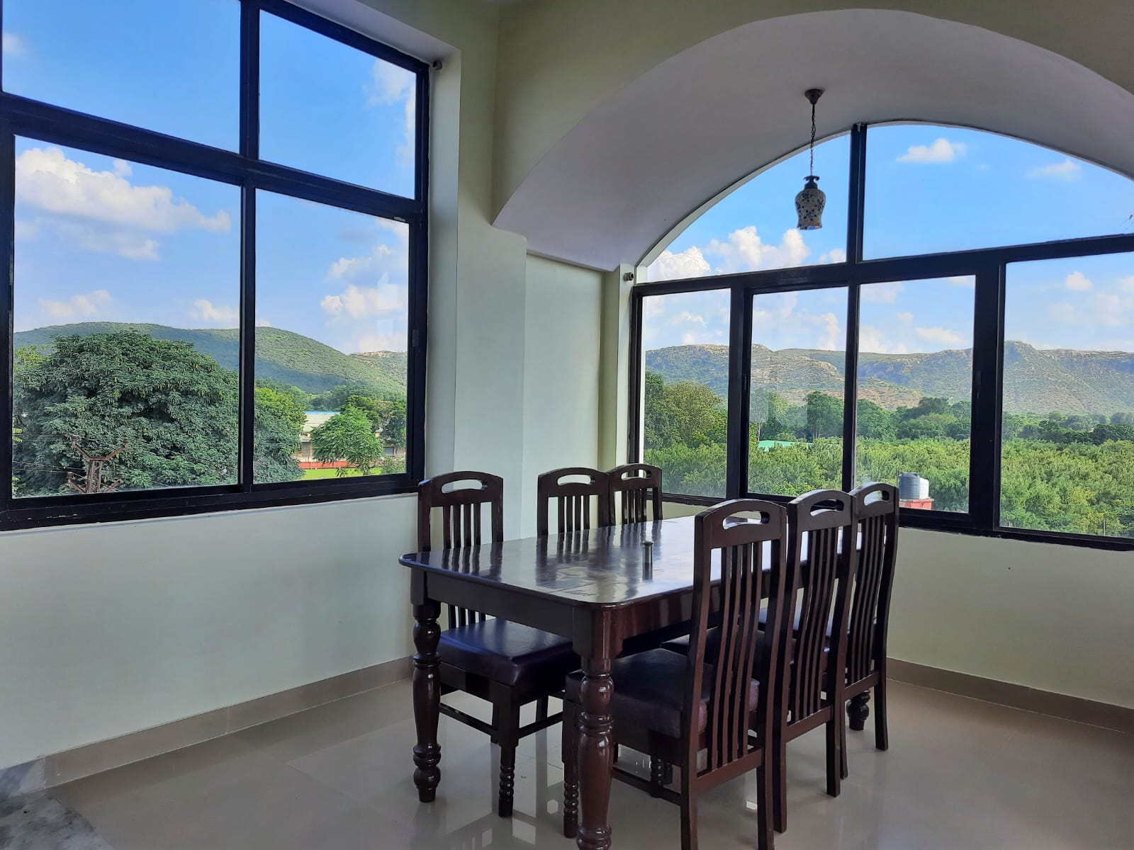 Rooftop restaurant with Aravalli Hills view